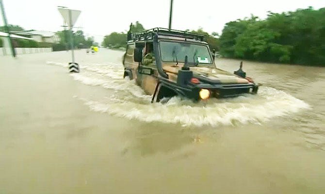 ‘Once in a century’ floods hit northeast Australia