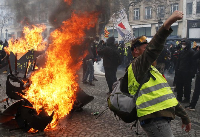 France cleans up Champs-Elysees after yellow vest rioting
