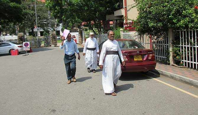 Catholic priests file case against Ranil , Pujitha and Hemasiri