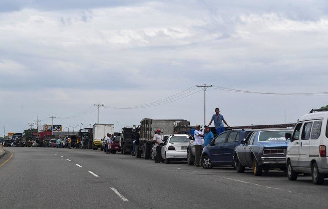 Tempers flare as oil-rich Venezuela starts to ration gas at the pumps