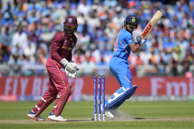Kohli, Dhoni smash half-centuries to power India to 268-7 against West Indies
