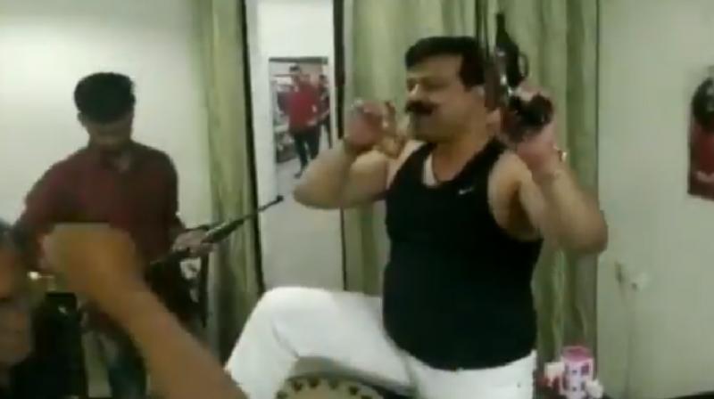 With 4 guns, a glass of alcohol, U’khand's sacked BJP MLA dances to Hindi song