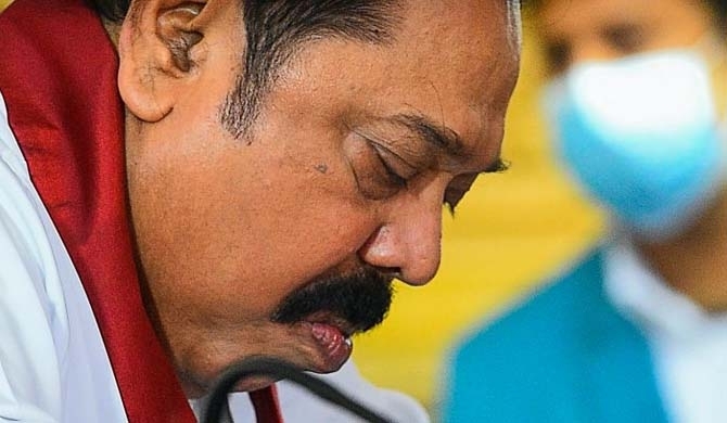 Mahinda refuses to step down to make coverage against their frauds !