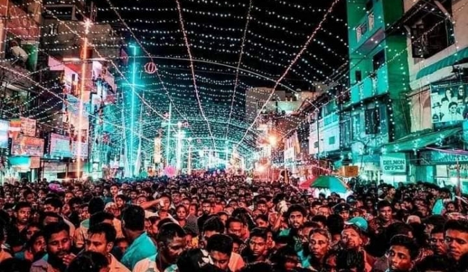 Sri Lankans take to the streets, defying curfew & the rain