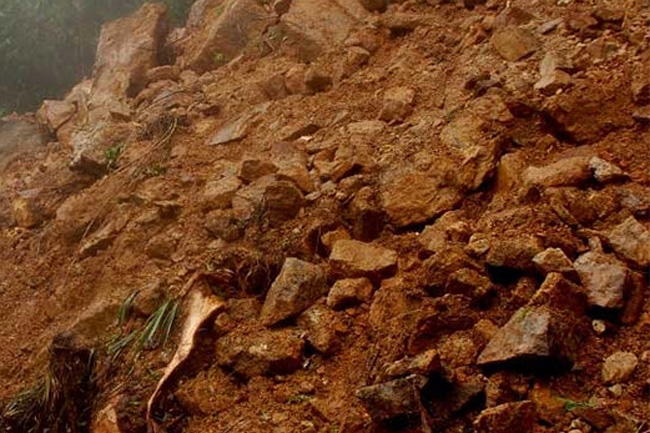 Four people trapped after house buried in landslide; one rescued