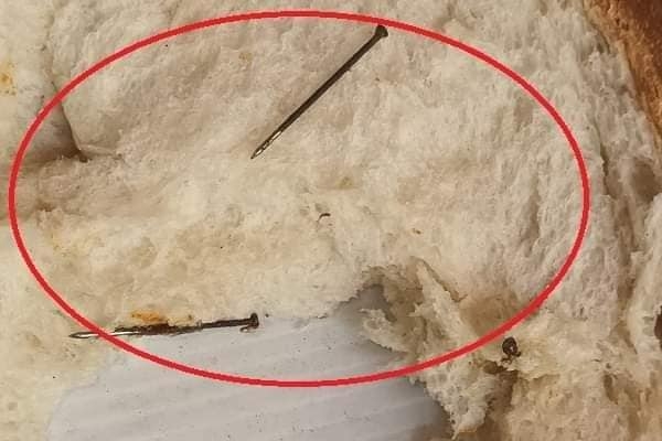 Three rusted paper pins within a loaf of bread bought in a shop in Jaffna!